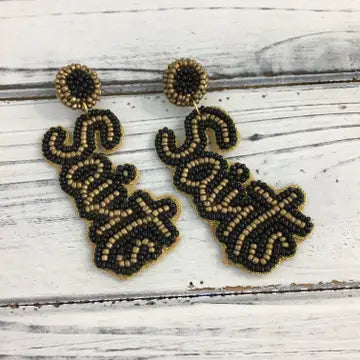 Them boys in black n gold earrings